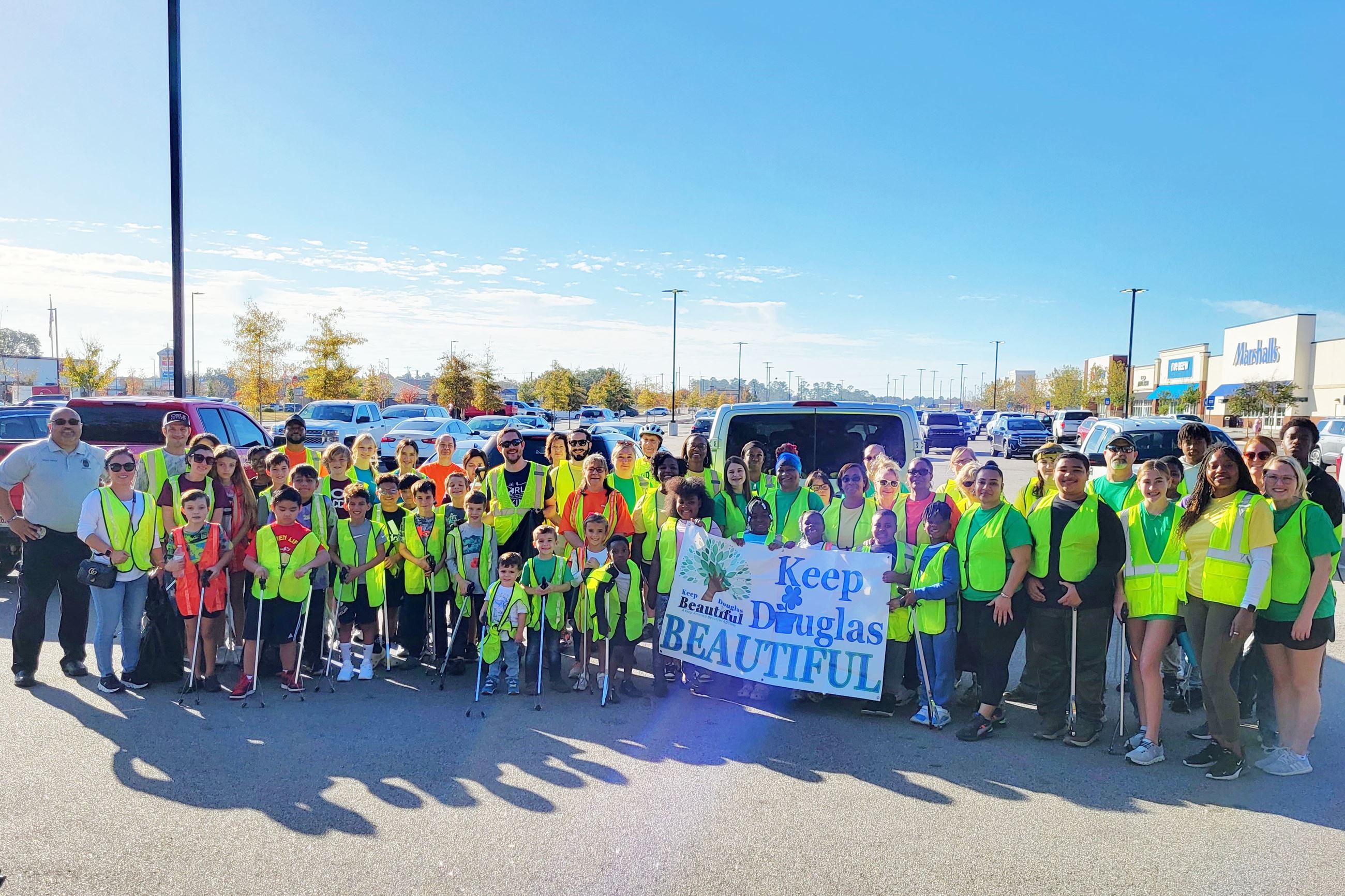 Photo of the volunteers holding a banner that says Keep Douglas Beautiful