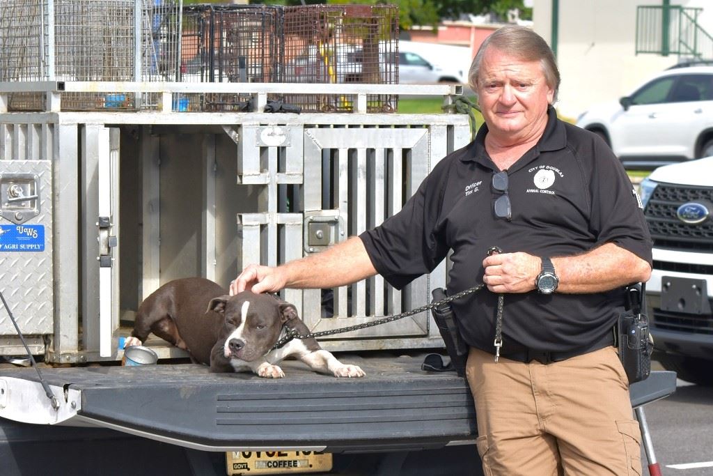 Image of a man with a dog that has been neglected
