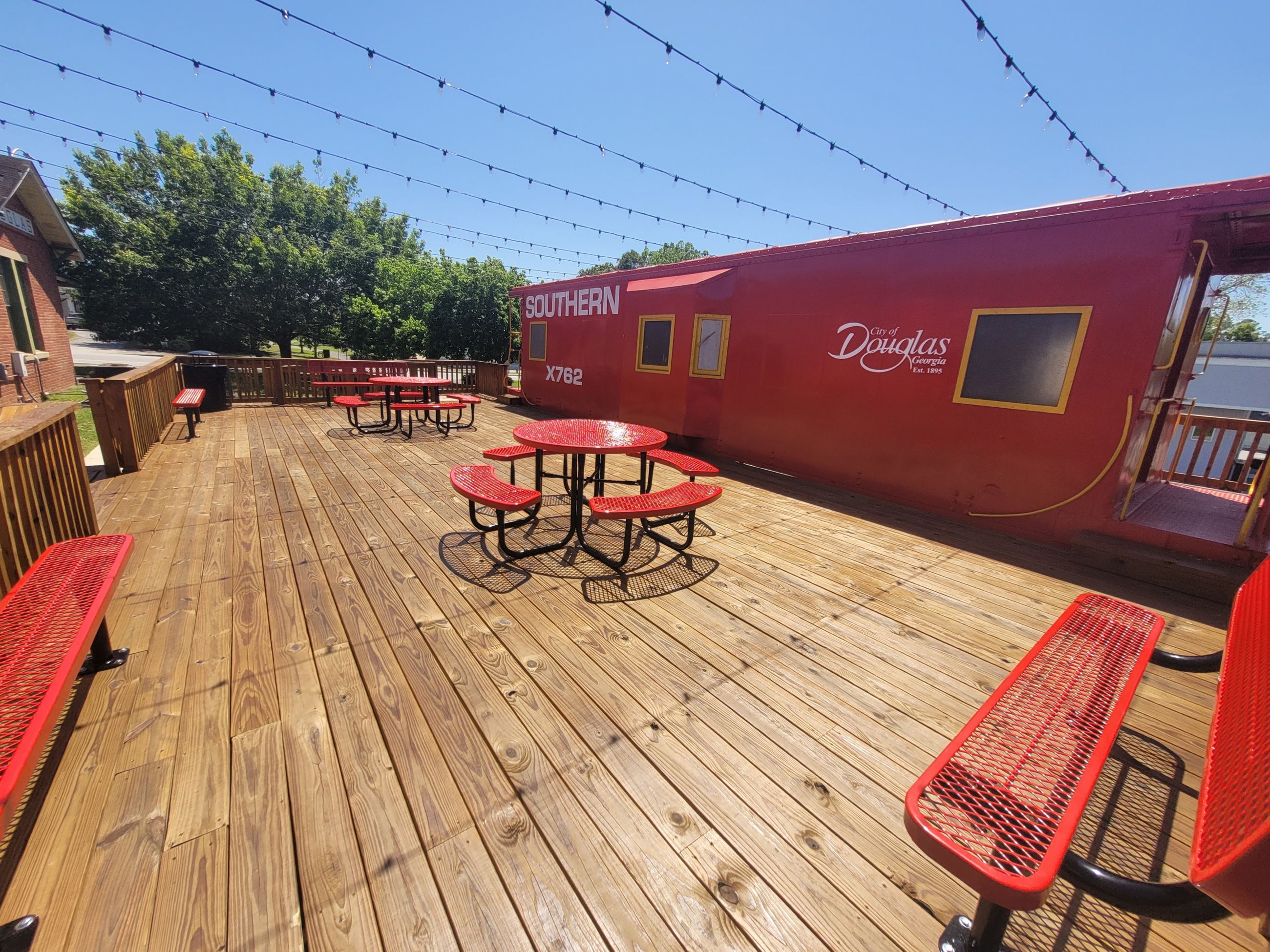 Image of caboose deck with outdoor furniture