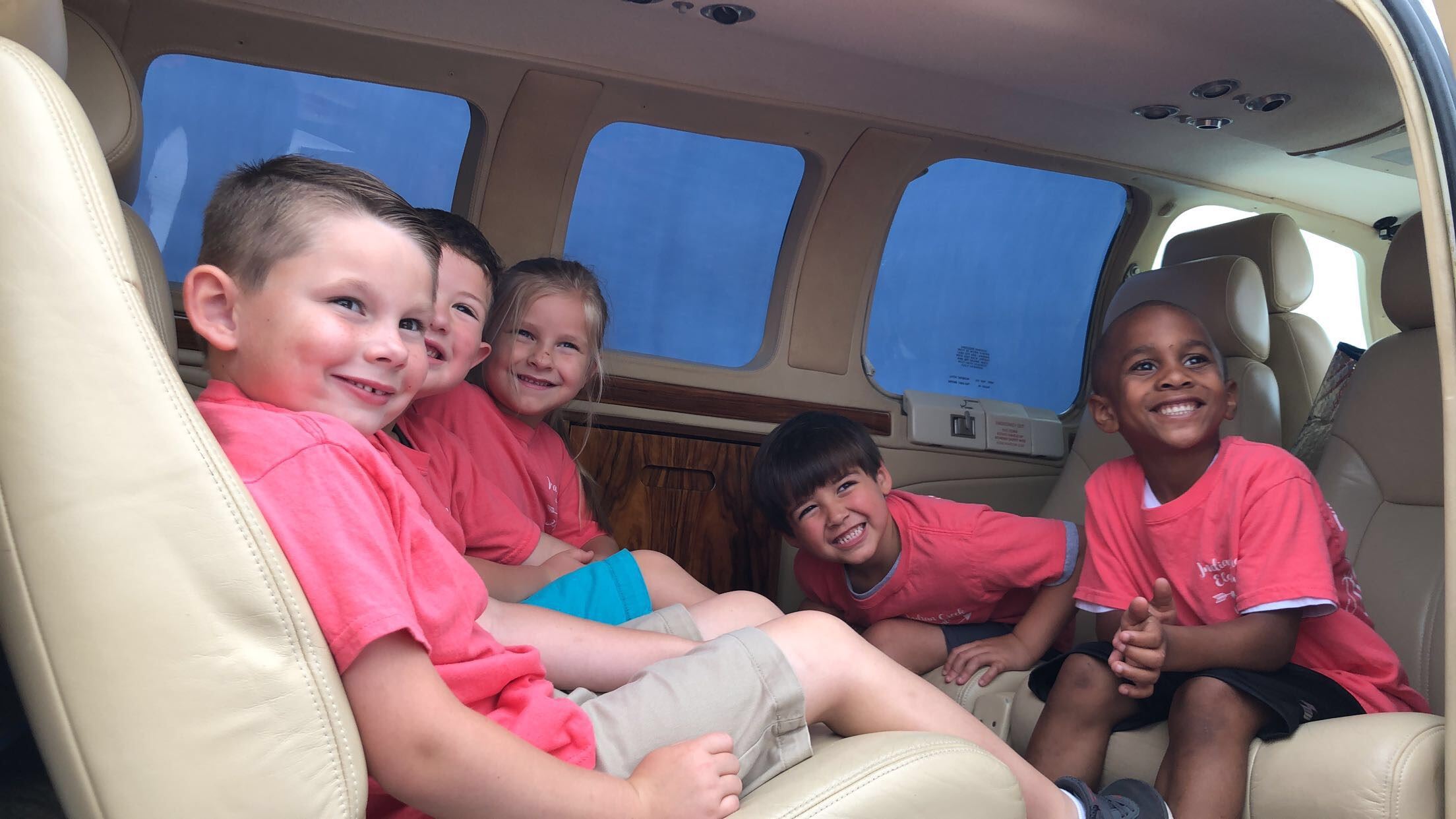 Photo of Children on a School Tours inside a jet plane