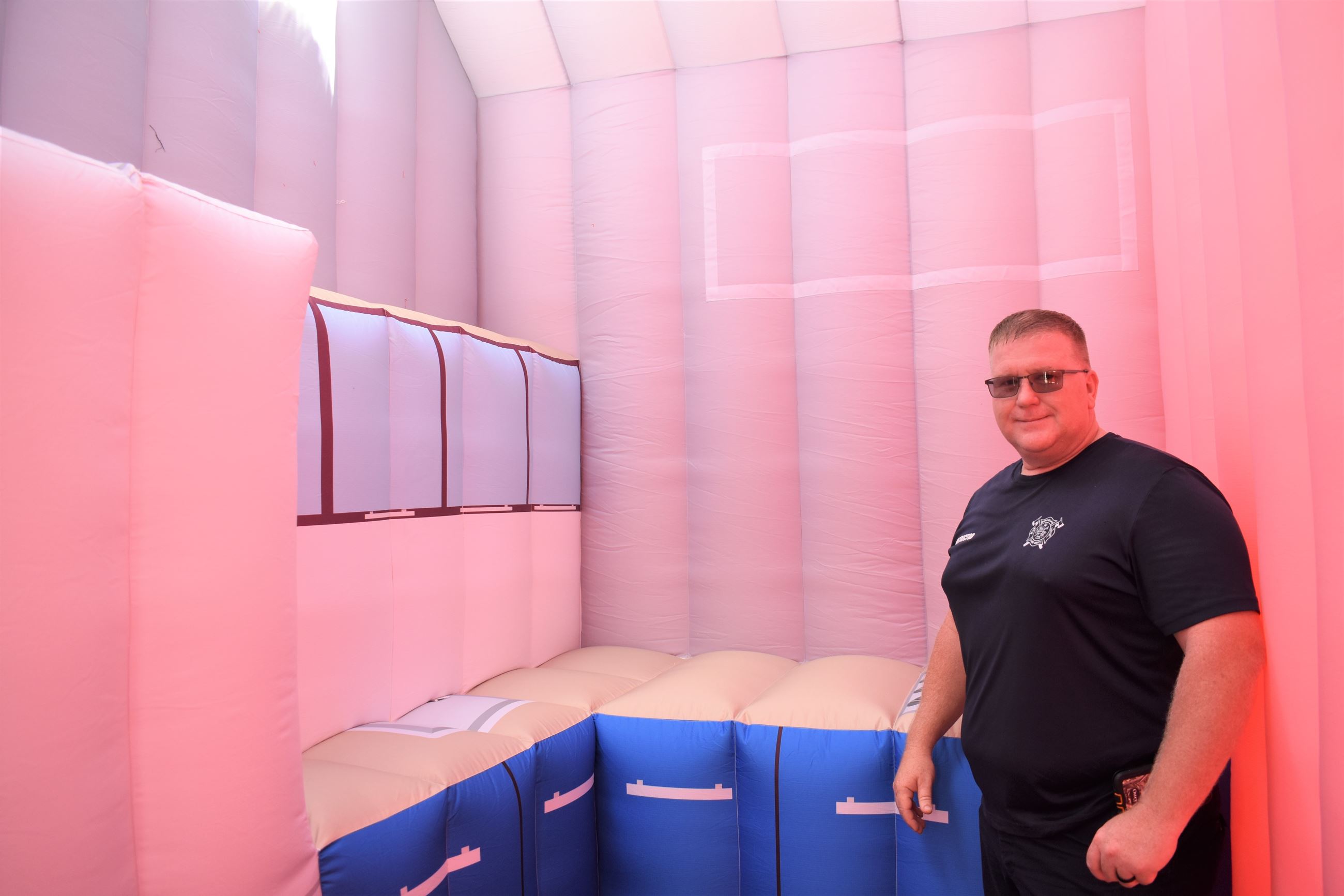 Photo of Chief Wright inside the Kitchen in the Fire Safety House