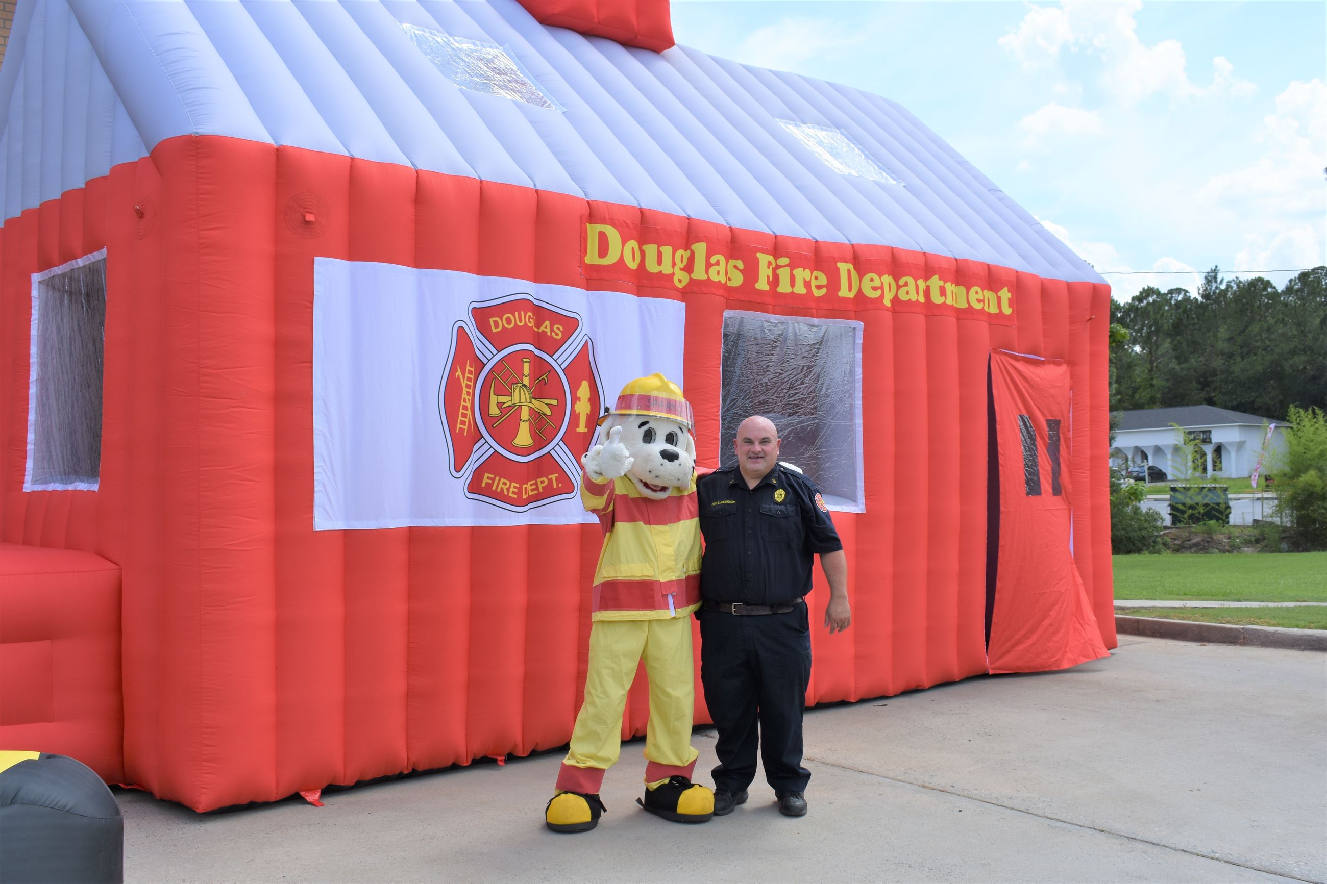 Photo of Fire Dog with  DFD Fire Inspector Brantly Anderson